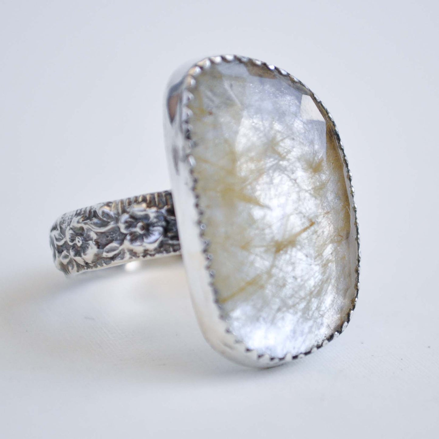 Ring with a natural stone design on a white background