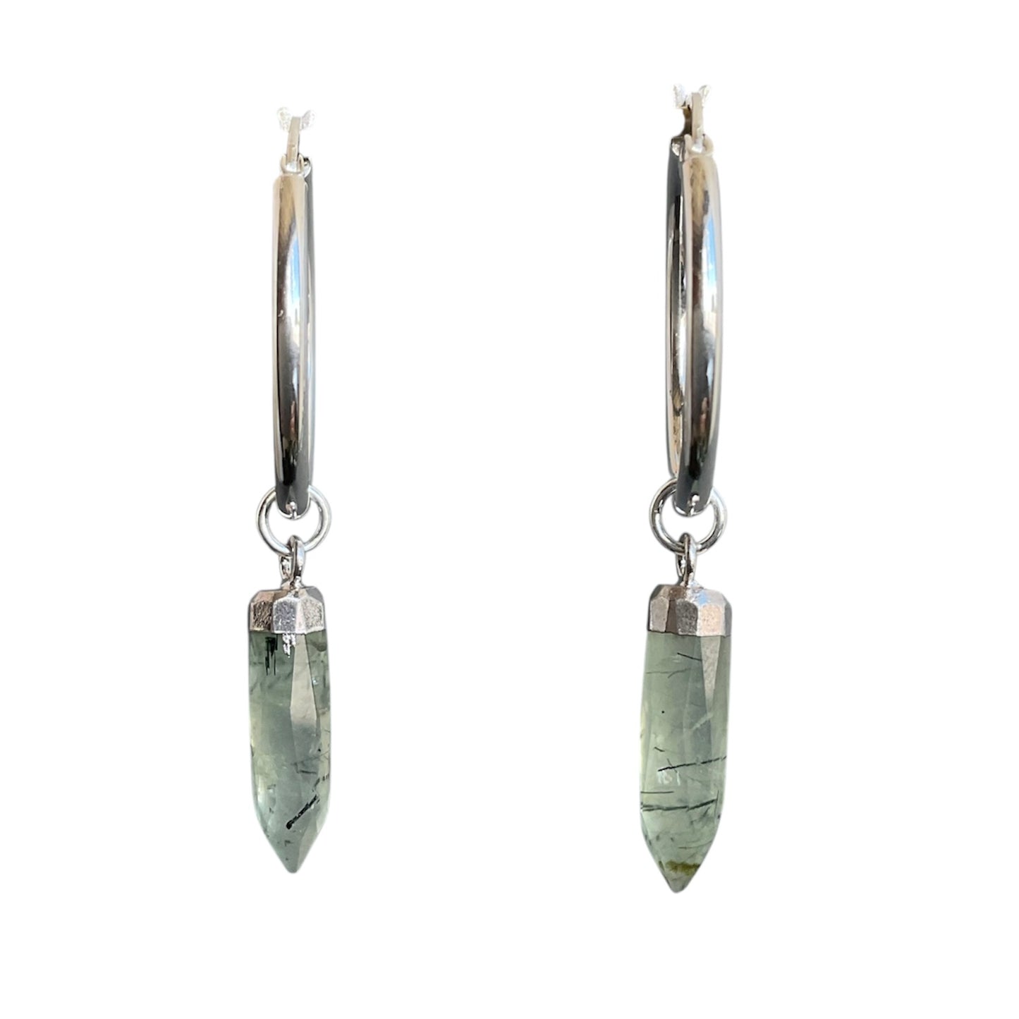 Pair of silver hoop earrings with green stone pendants on a white background