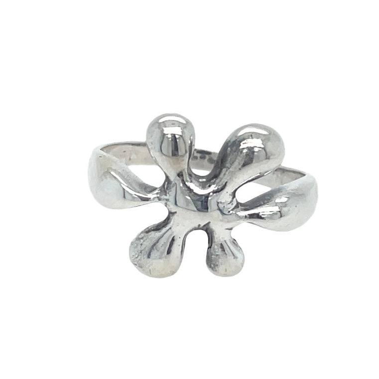 Silver four-petal flower ring on a white background