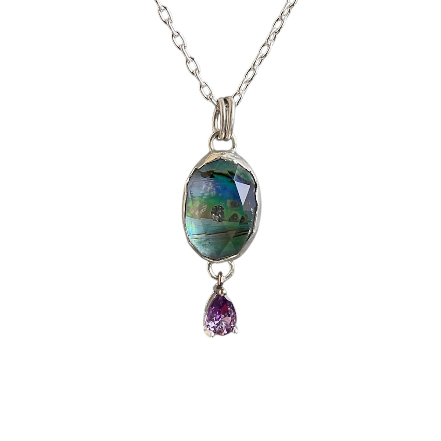 Sparkly abalone and quartz doublet with a faceted amethyst teardrop stone hanging underneath. Solid sterling silver setting and chain.