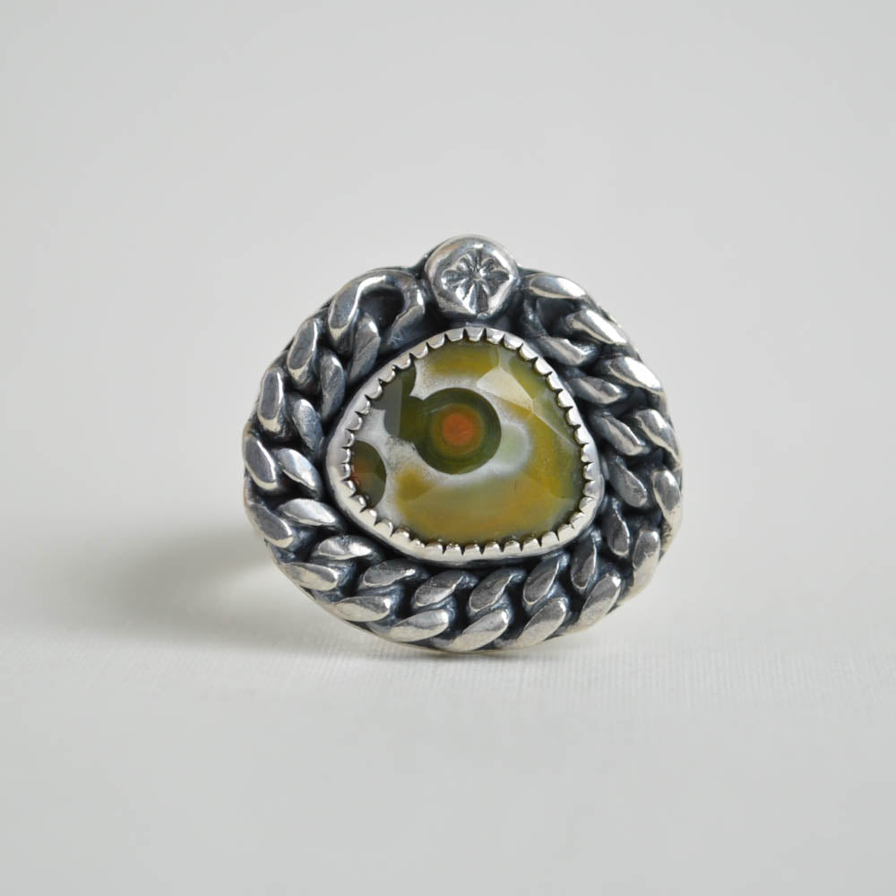 Green ocean jasper gemstone with a cuban chain link border and ring band. Solid sterling silver.
