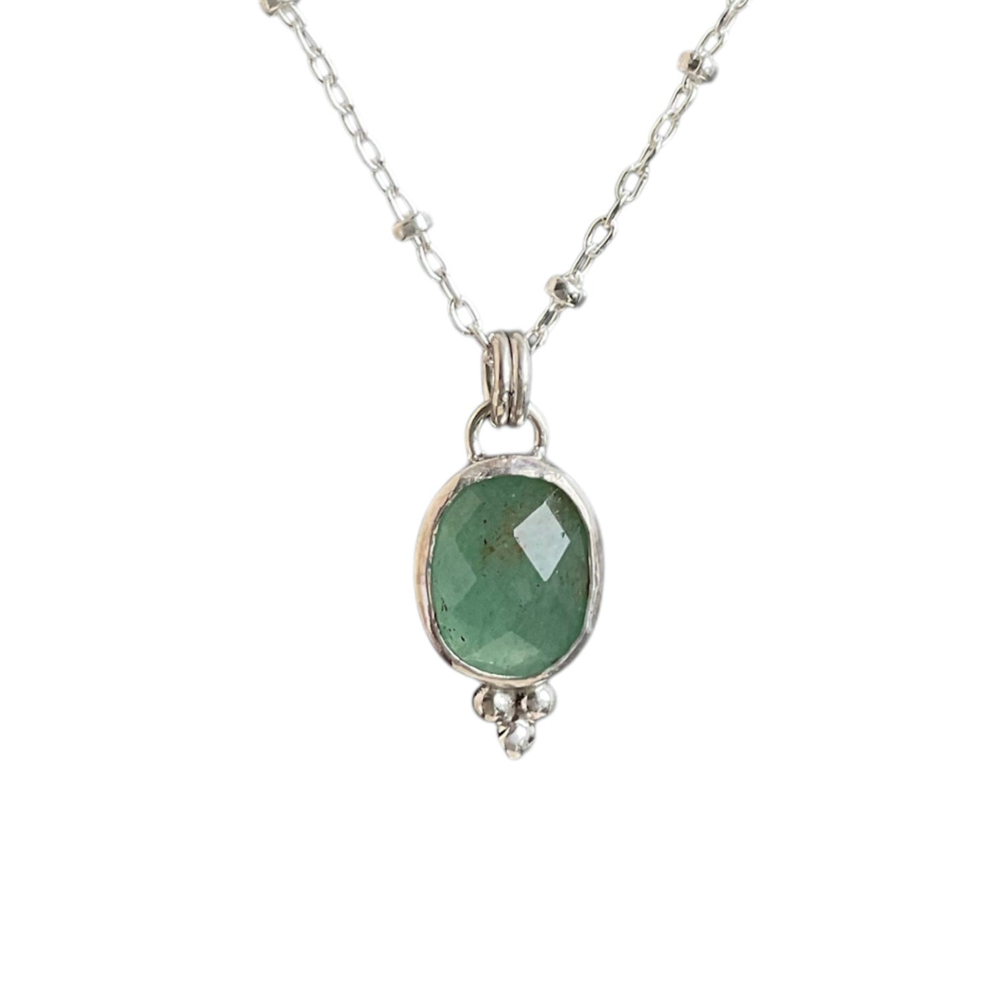 Sage green jade gemstone set in a bezel with a bead embellishment at the bottom. Solid sterling silver setting and chain.