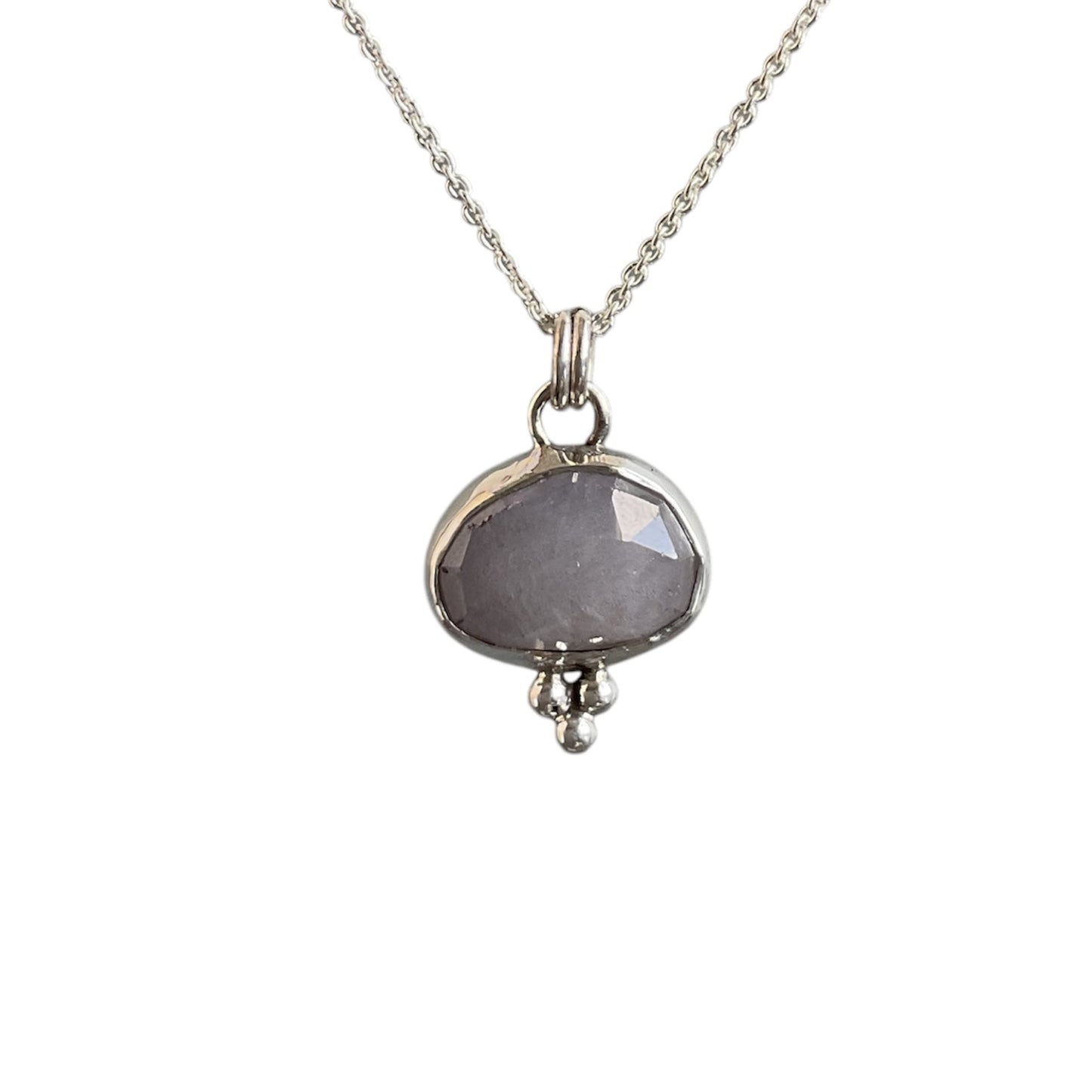 Gray cloud sapphire bezel set with a trio of silver beads at the bottom. Solid sterling silver setting and chain.