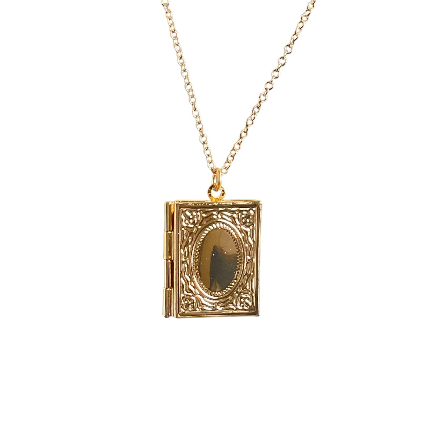 Gold locket shaped like a book, hanging from a 14k gold-filled chain