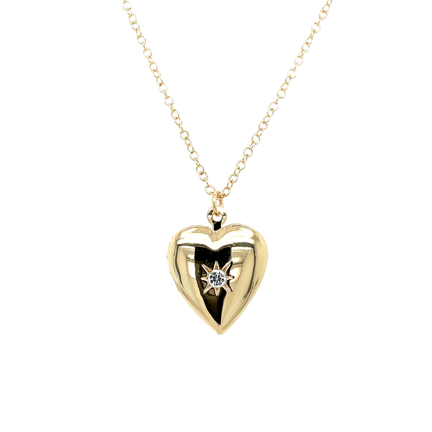 A simple heart shaped locket with a sparkly cubic zirconia gemstone in the center. This locket opens at the hinge and comes on a 14k gold-filled necklace.