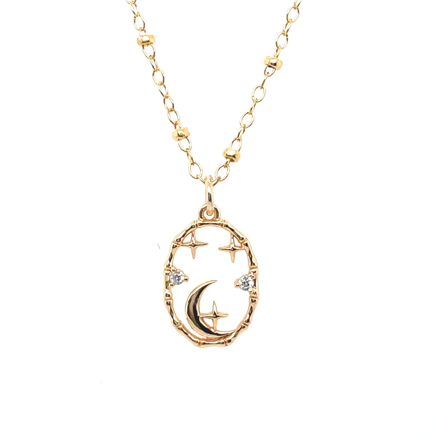 Classic oval frame pendant with moon and stars set inside, on a 14k gold-filled chain.