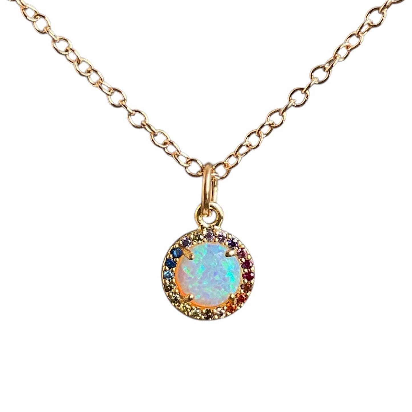 Opal gemstone with a rainbow cz border on a gold chain.