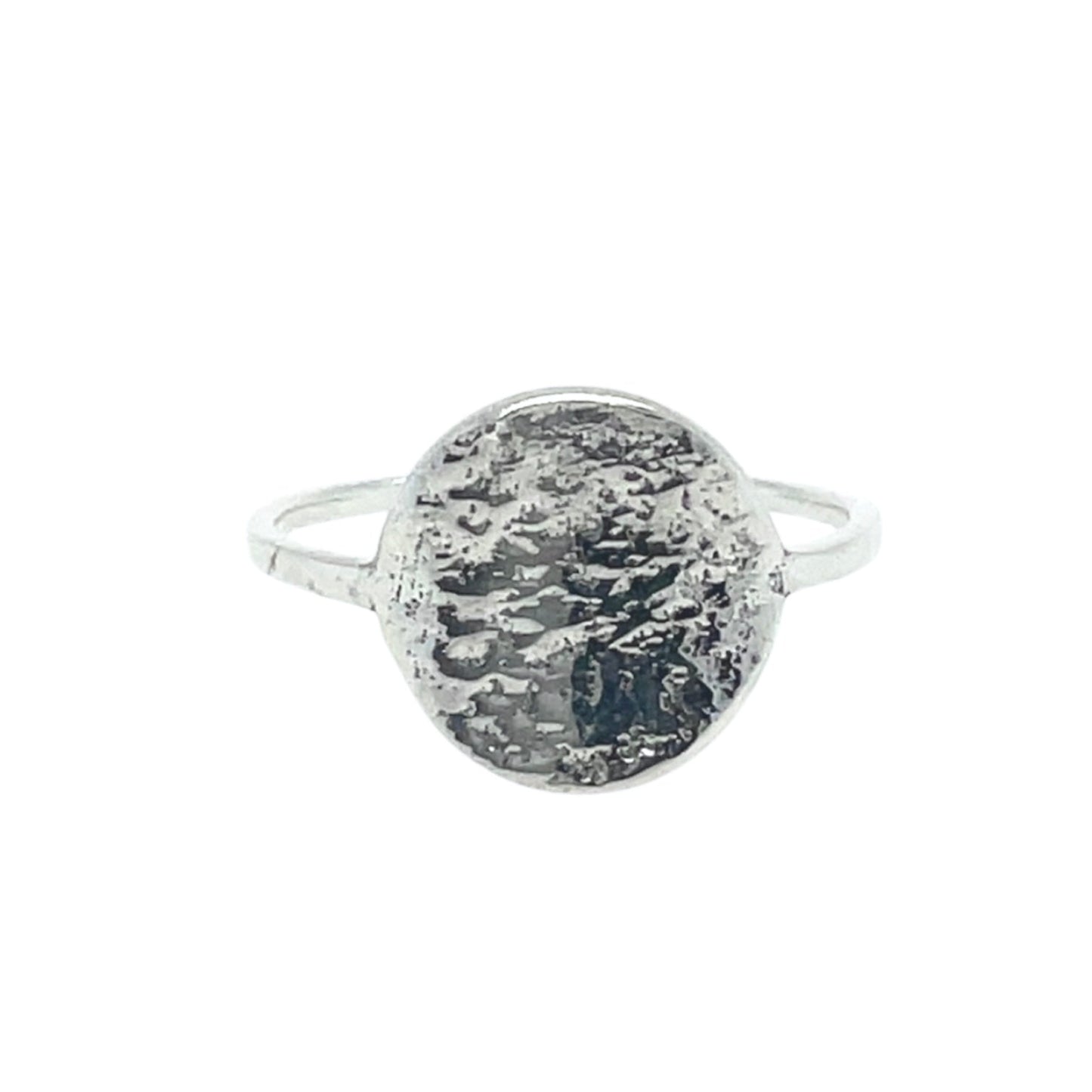 A textured full moon on a thin dainty band in shiny sterling silver.