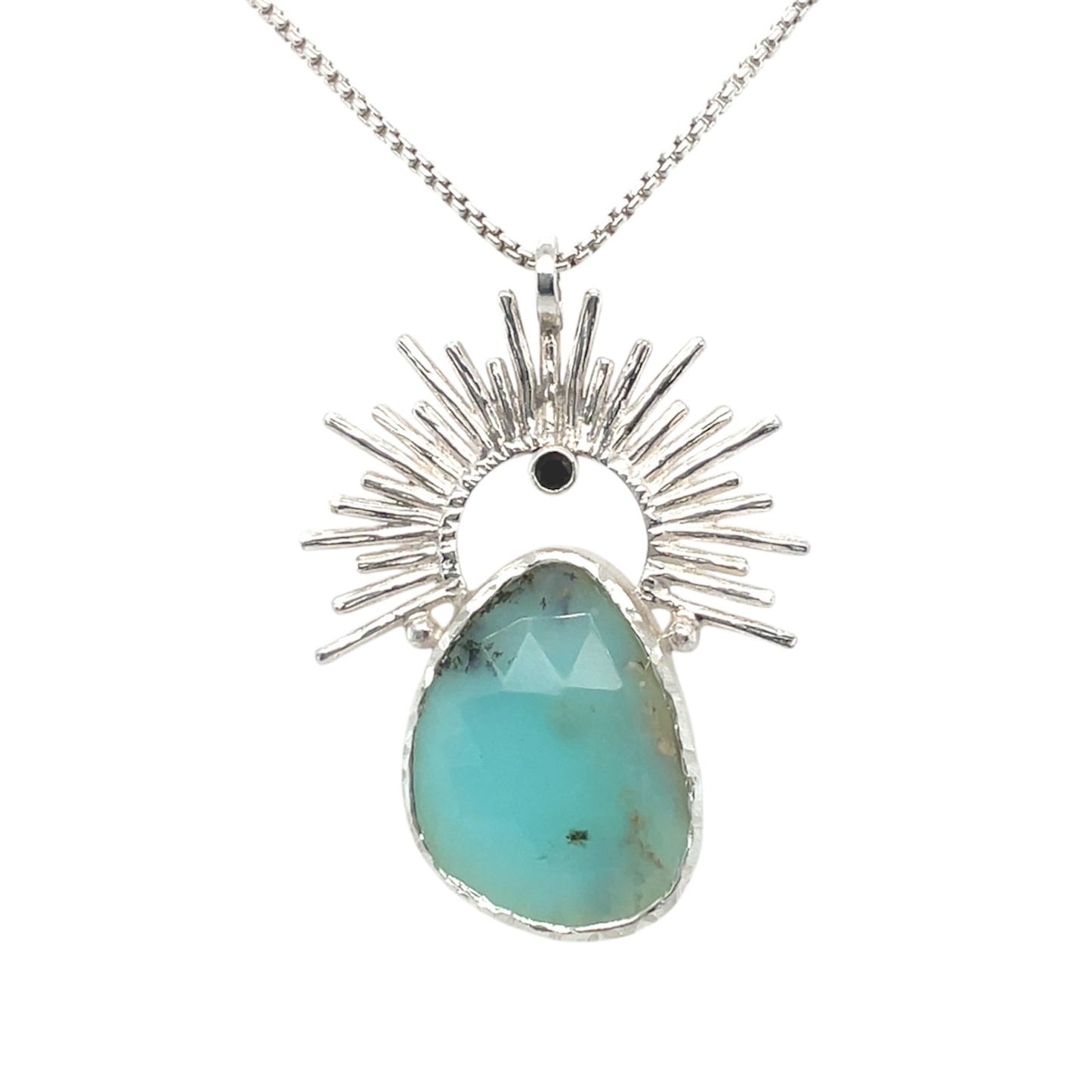 A large asymmetrical peruvian opal pendant necklace set in sterling silver and embellished with a sterling silver sunrise frame.