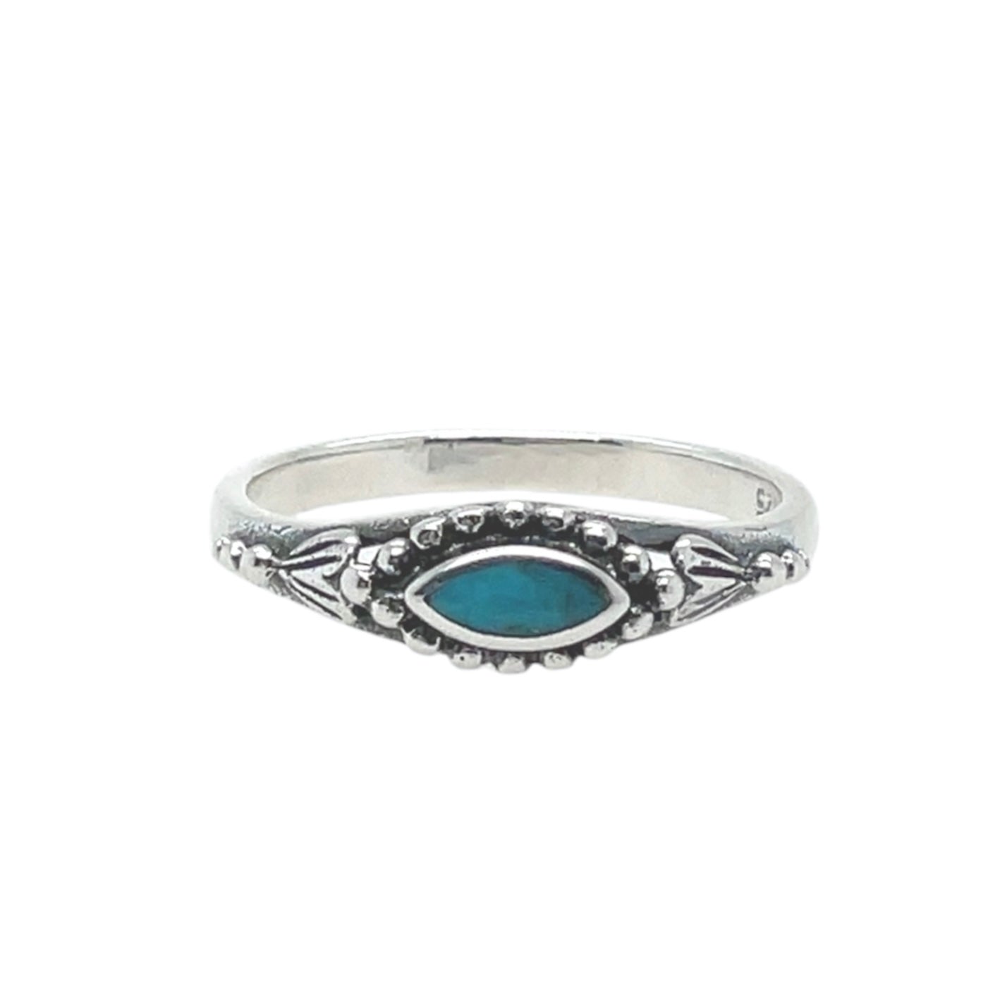 Lovely teal blue marquise turquoise stone with a beaded border.