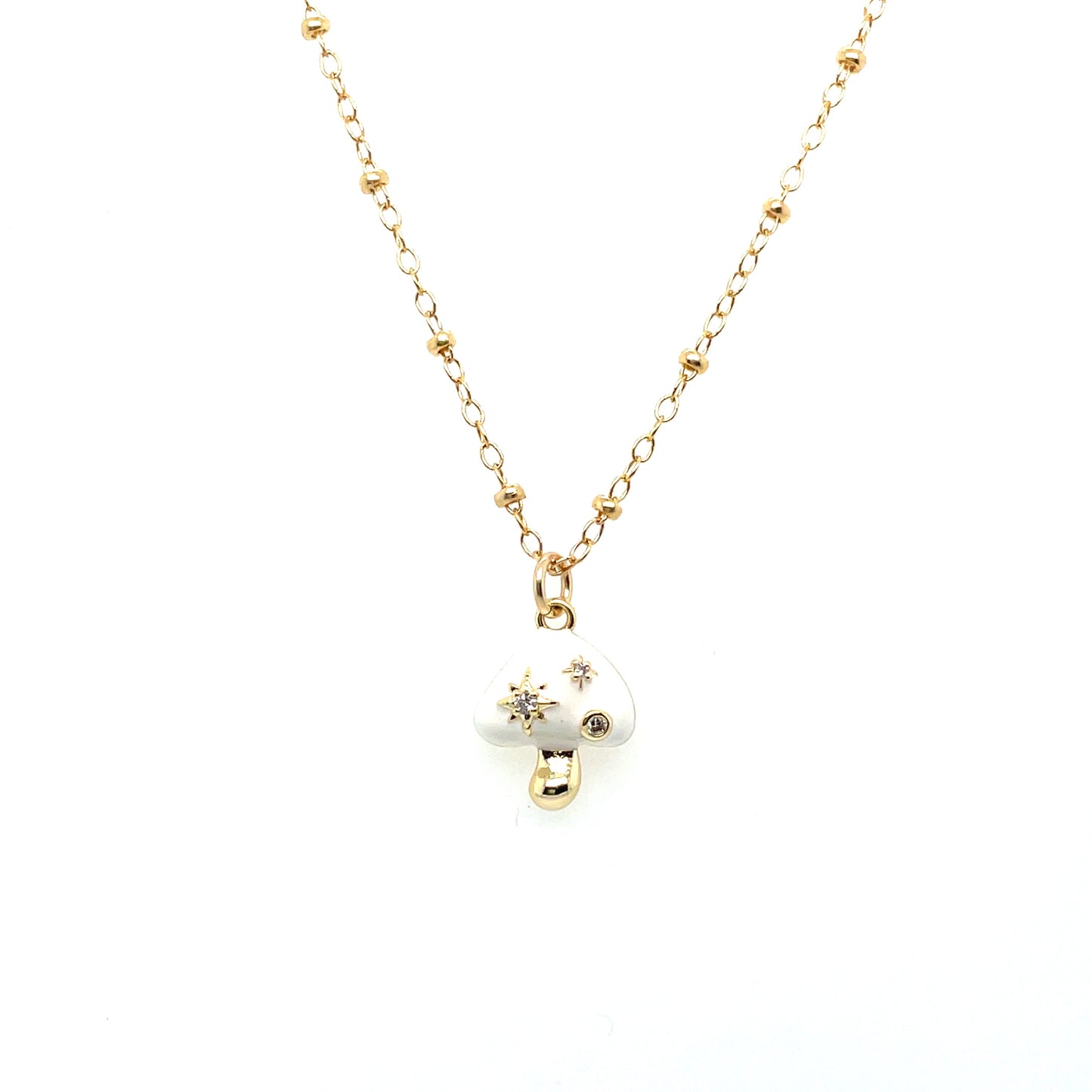 A white mushroom charm necklace on a 14k gold-filled chain.