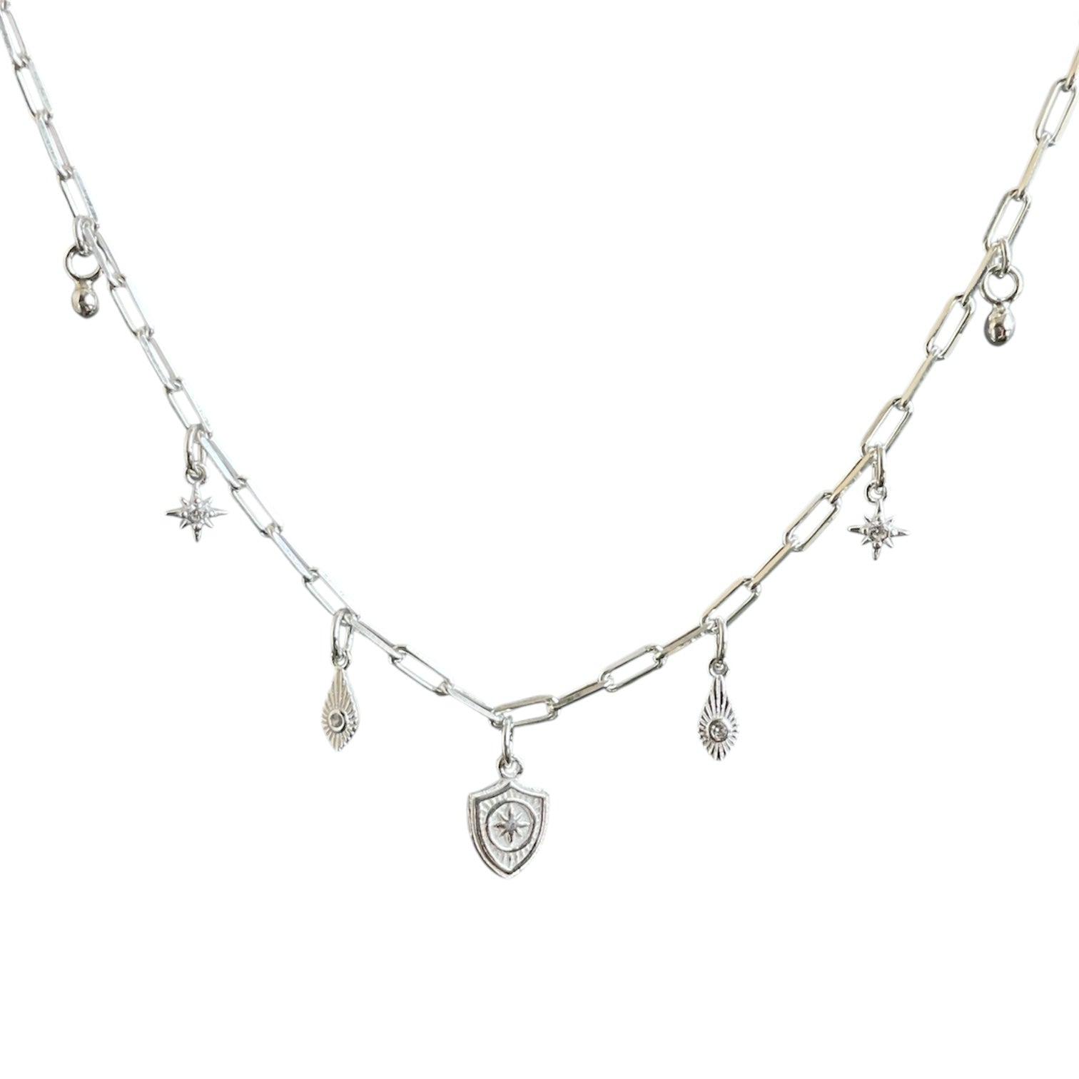 Sterling silver paperclip chain with cascading charms including a sheild, dagger, north star and bead drops