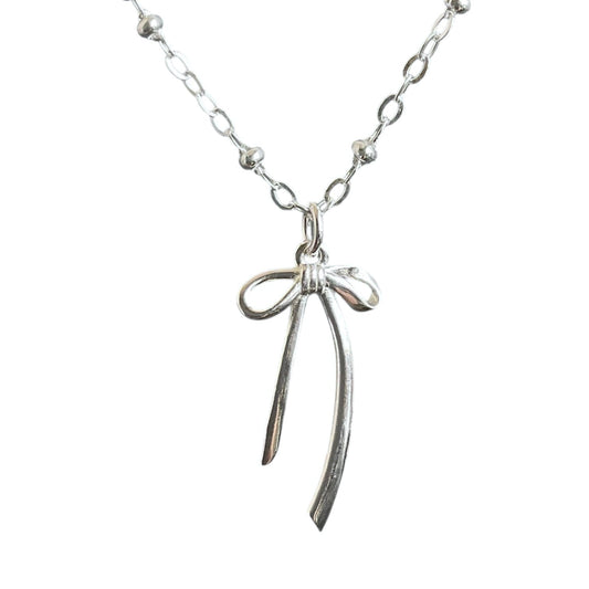 Sterling silver bow charm on a satellite chain.
