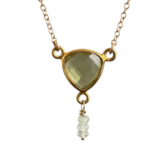 Necklace with a triangle-shaped green gemstone pendant on a white background