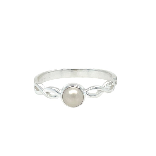 Silver ring with a pearl on a white background