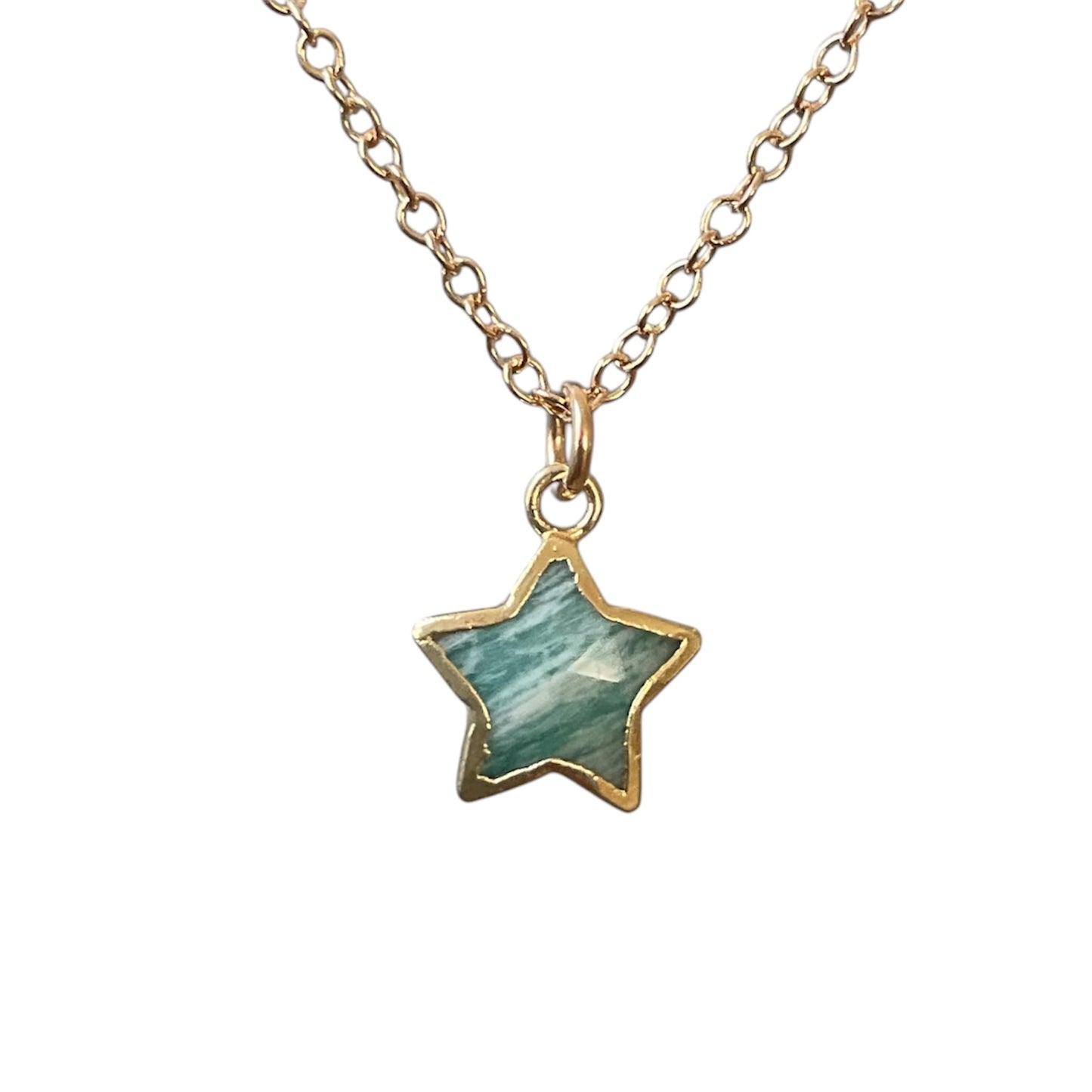 Star-shaped pendant necklace with gold chain on a white background