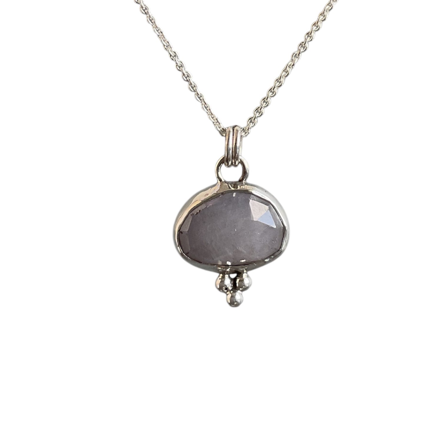 Gray cloud sapphire bezel set with a trio of silver beads at the bottom. Solid sterling silver setting and chain.