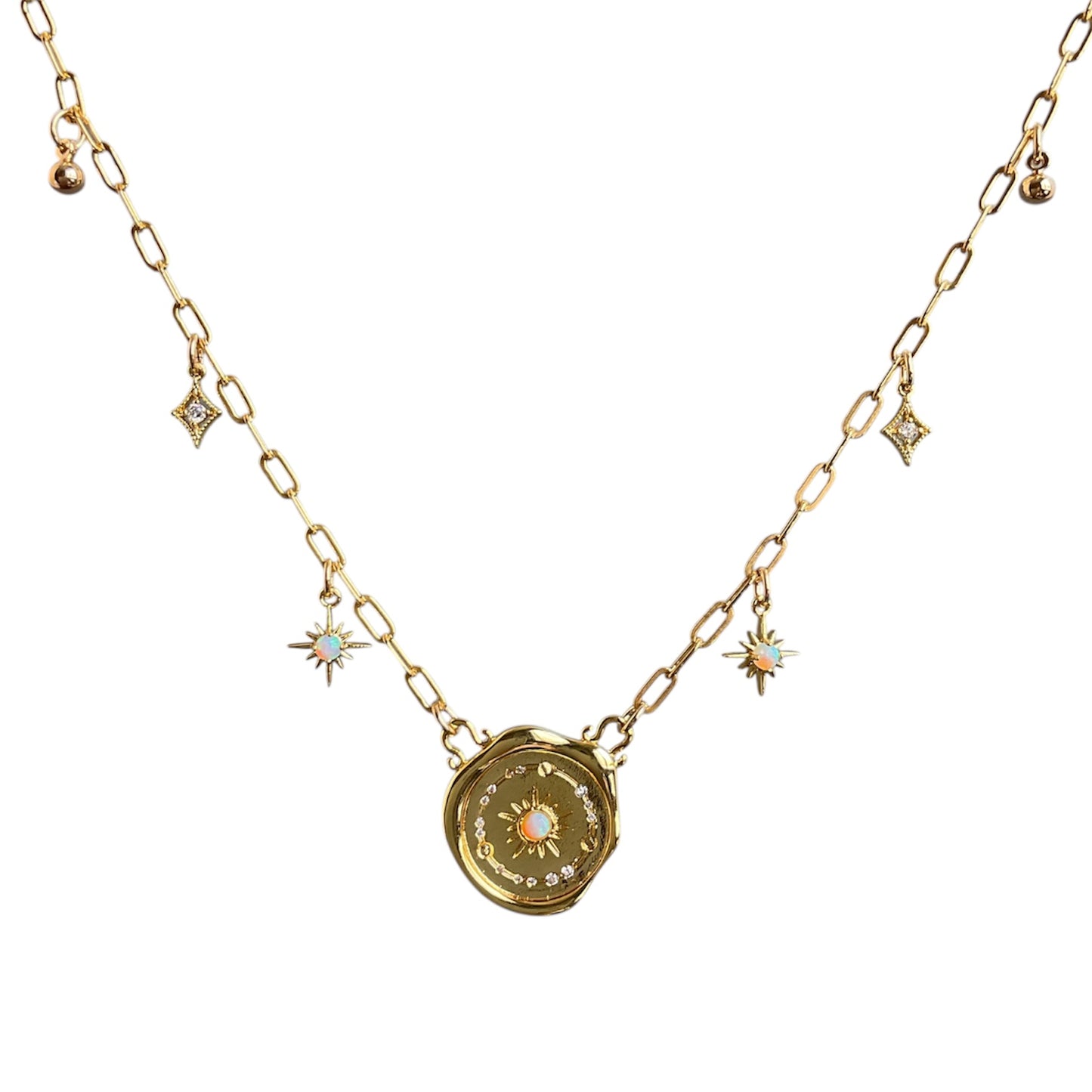 Gold necklace with a decorative pendant on a white background