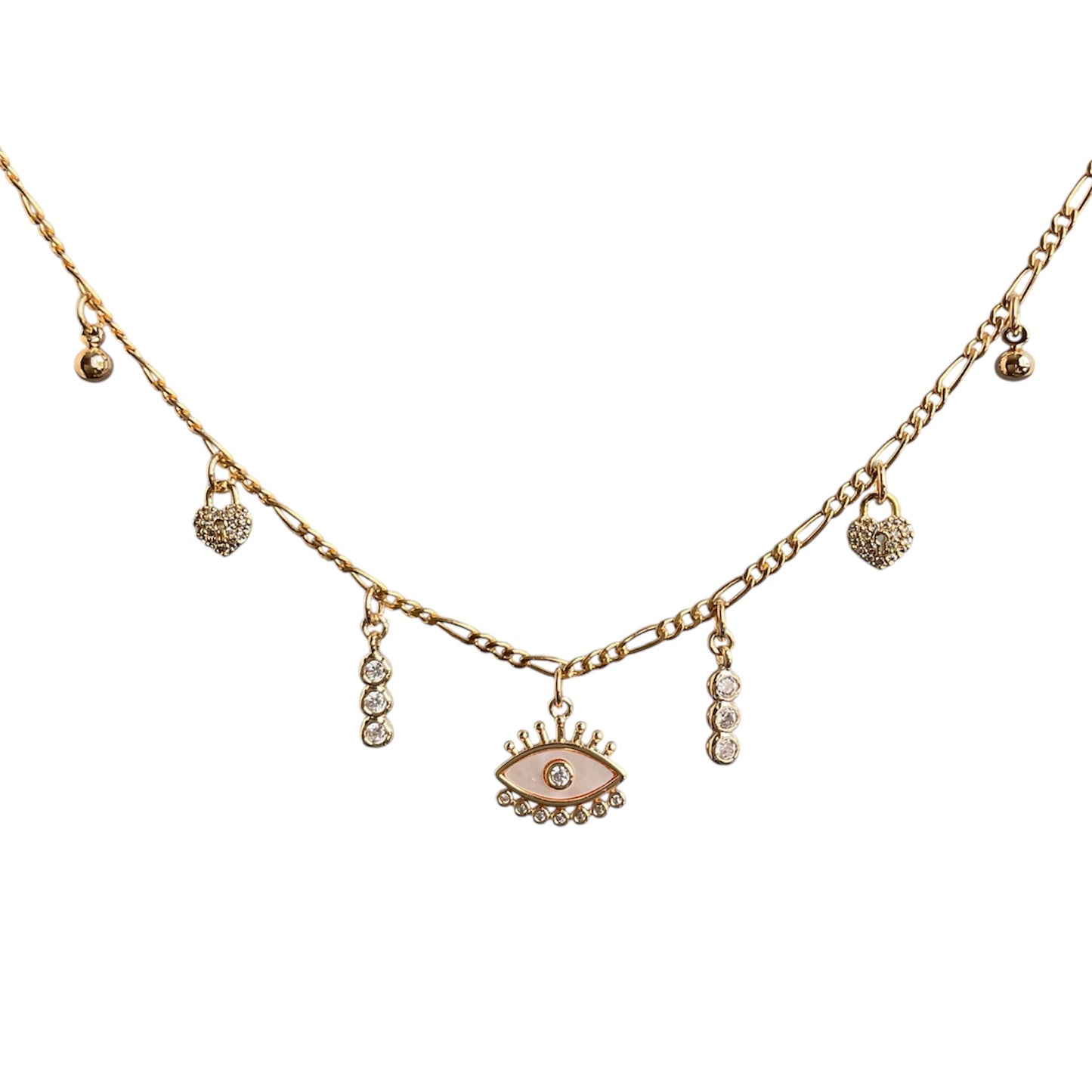 Gold necklace with eye-shaped pendant and heart charms on a white background