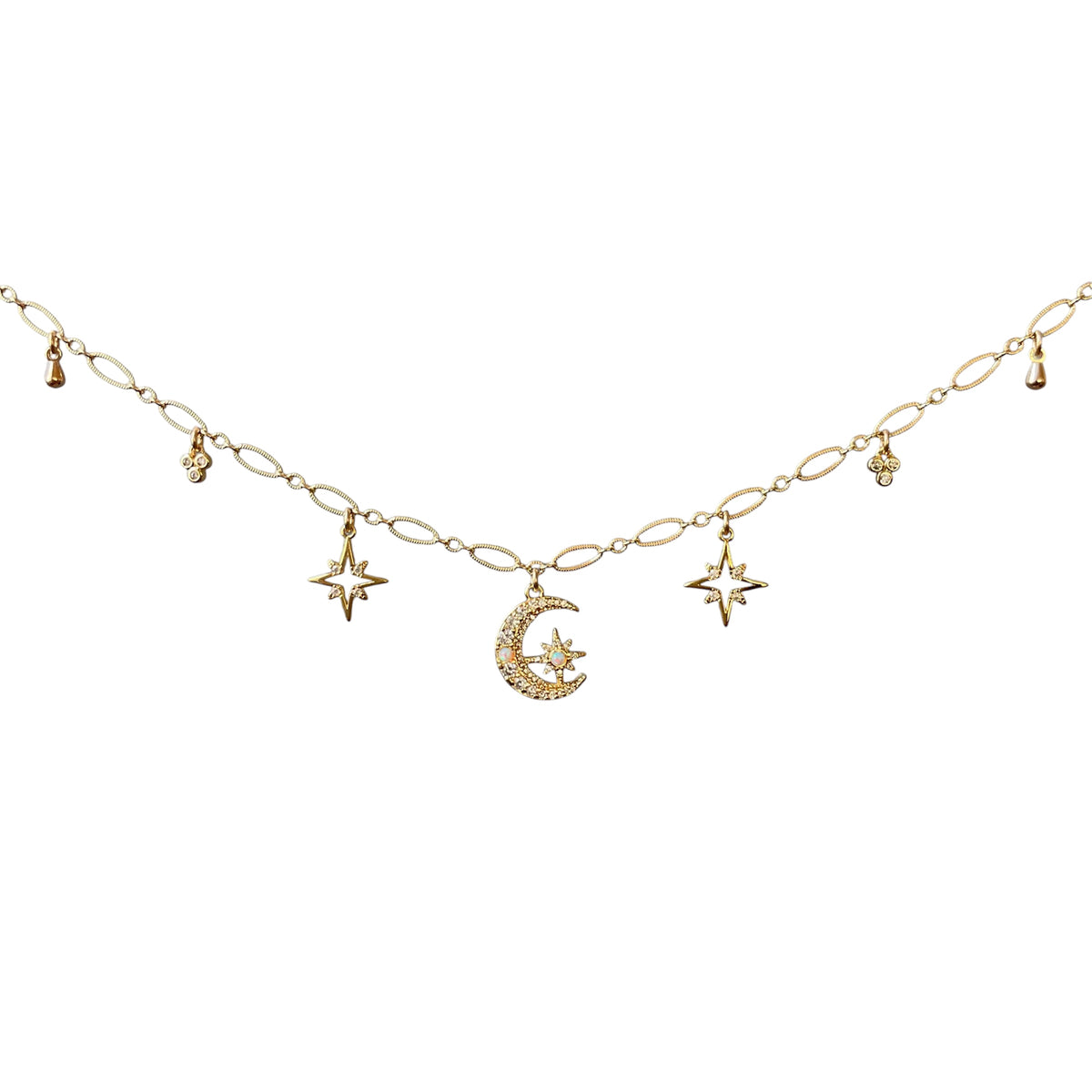 A delicate gold chain necklace featuring a central crescent moon and star pendant, flanked by smaller star and teardrop charms, displayed against a solid white background.