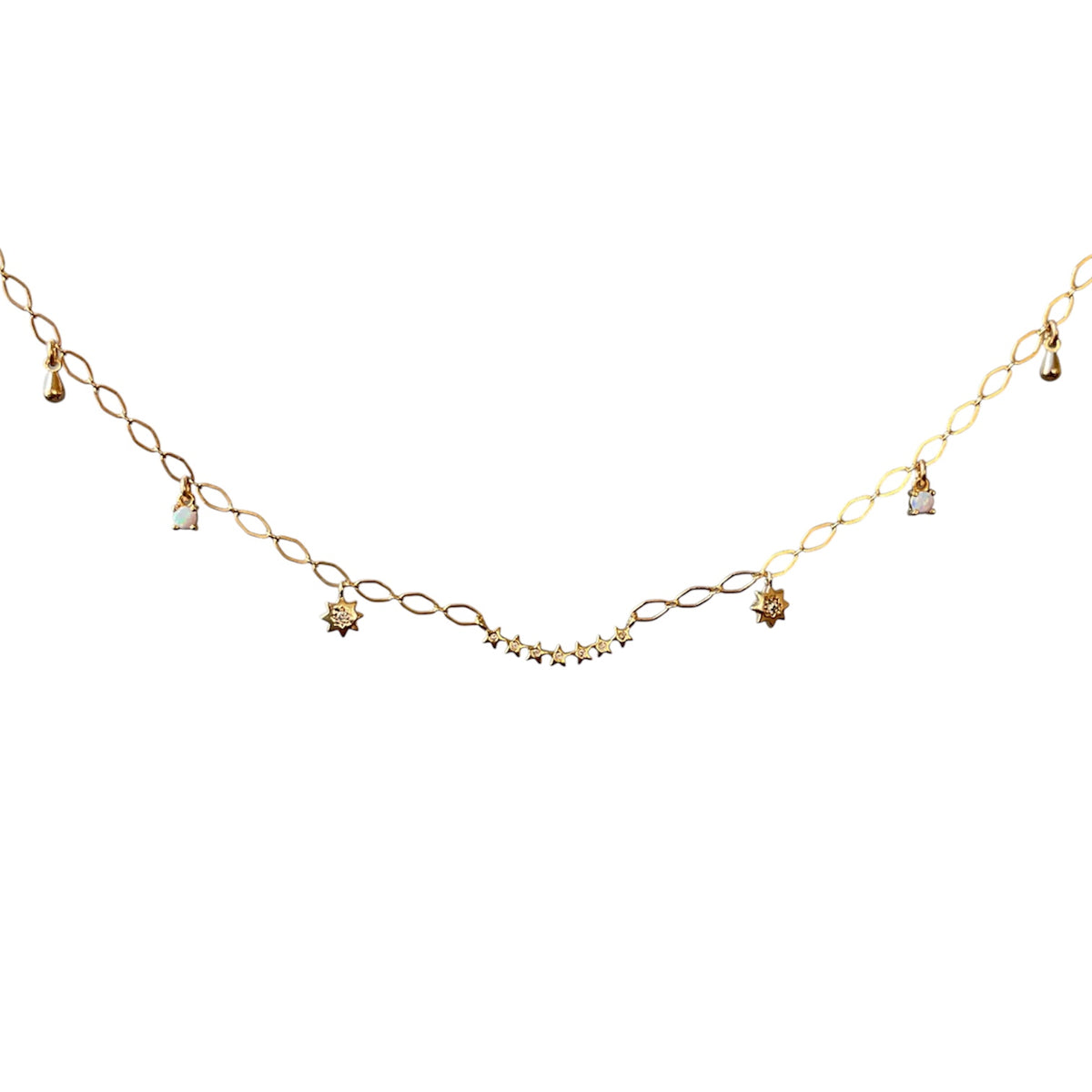 A delicate gold chain necklace featuring alternating twisted oval links and small star-shaped charms, displayed against a solid white background.