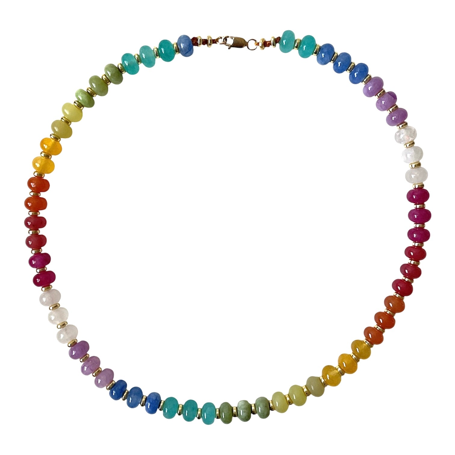 A beaded chakra necklace arranged in a circle, featuring faceted beads in rainbow colors separated by small gold spacers and white pearl-like beads, on a solid white background.