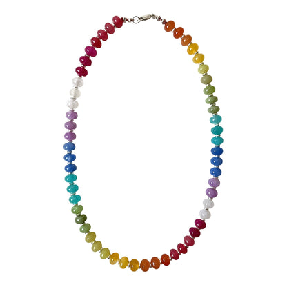 A beaded chakra necklace featuring seven distinct colors of polished round beads arranged in a circular shape, with a silver lobster clasp at the top, shown against a plain white background.