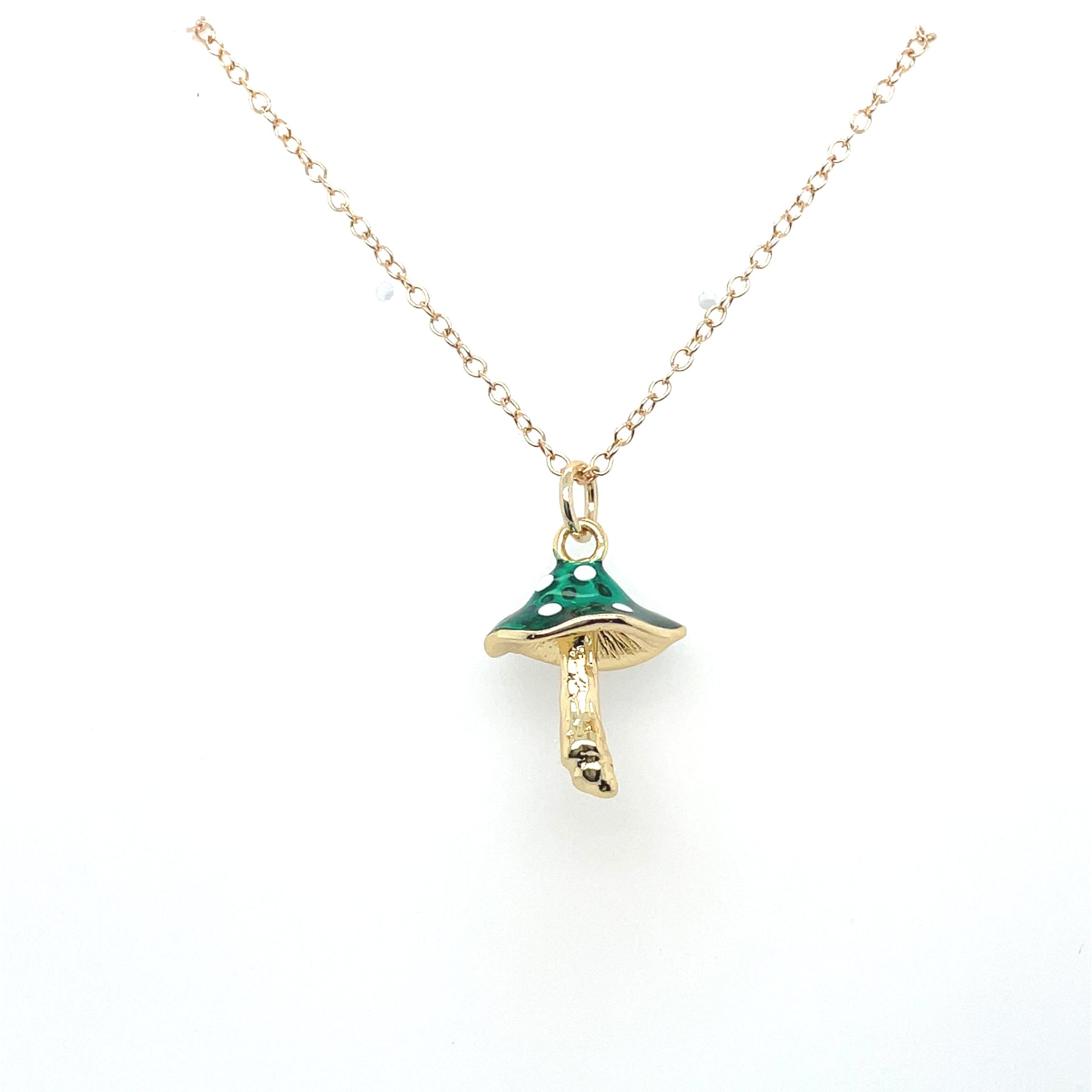A green mushroom charm necklace on a 14k gold-filled chain.