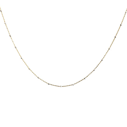 Gold chain necklace on a white background