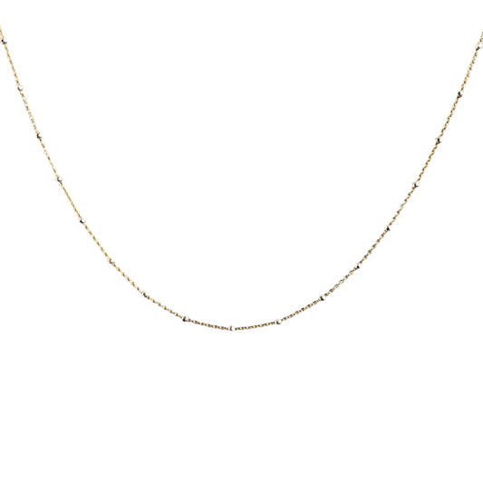 Gold chain necklace on a white background